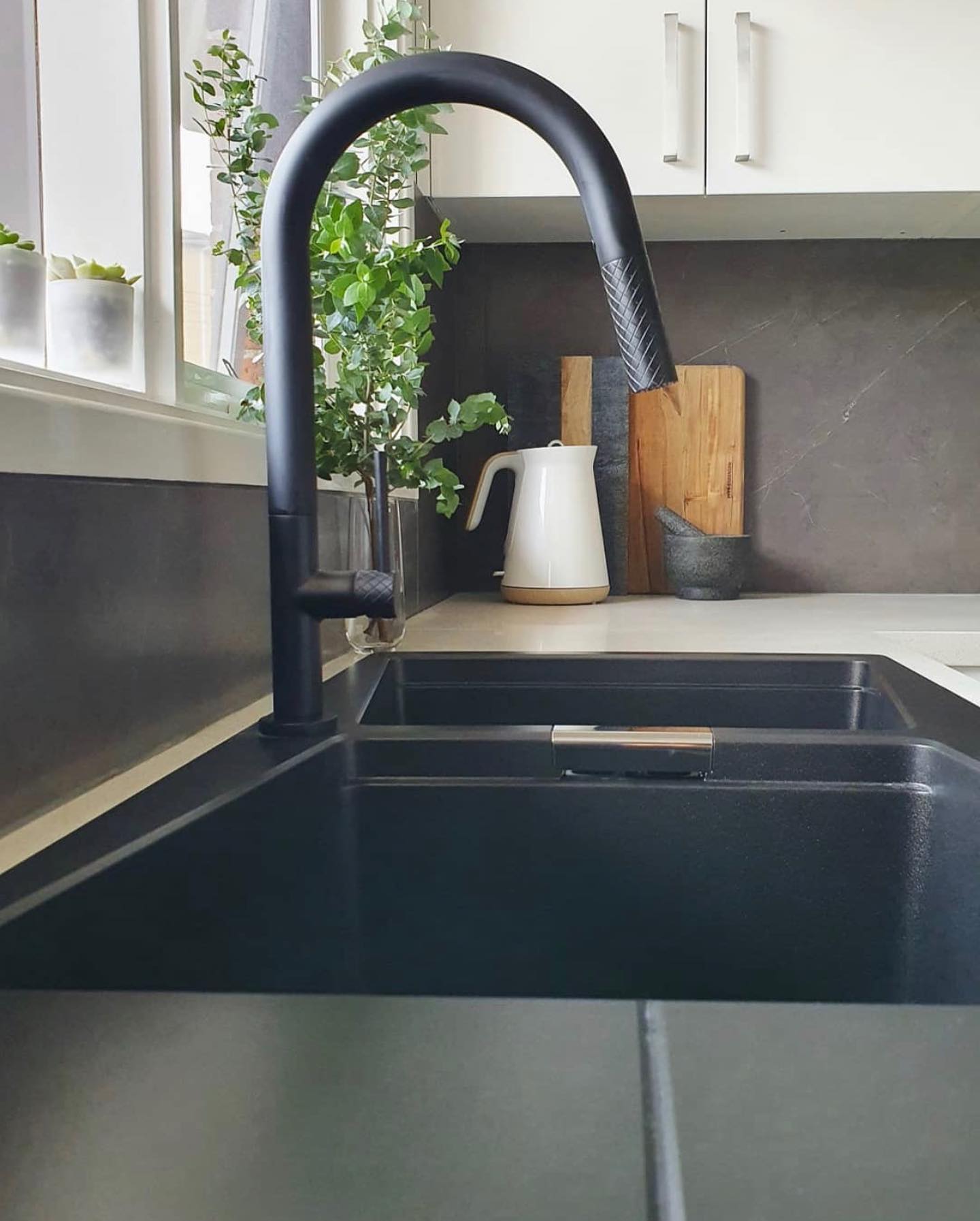 Greens Tapware Textura matte black pull out spray sink mixer.