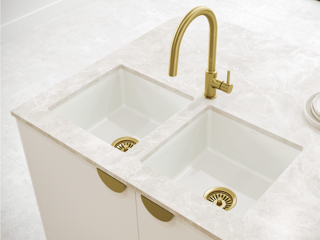 Argent Grace white granite sink with brushed gold wastes. Argent Vita brushed gold sink mixer.